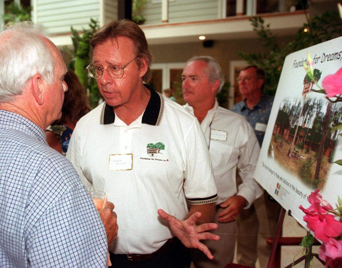 Eddie Mulock, center, founder and president of Foundation for Dreams Inc., talks with Manatee County civic leader Dick Turner at the foundation’s campaign kick-off in Parrish in this 09/07/2000 file photo.
