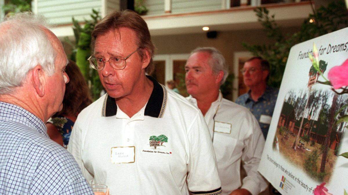 Eddie Mulock, center, founder and president of Foundation for Dreams Inc., talks with Manatee County civic leader Dick Turner at the foundation’s campaign kick-off in Parrish in this 2000 file photo.