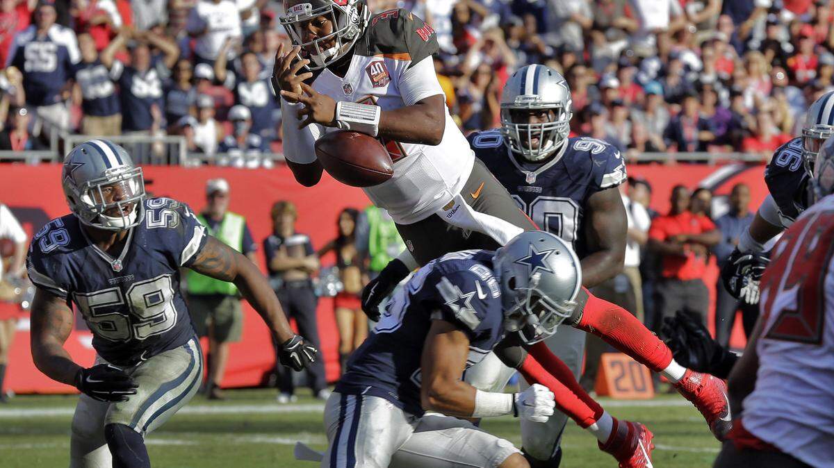 Tampa Bay Buccaneers quarterback Jameis Winston (3) fumbles the football as he gets hit by Dallas Cowboys defensive back Tyler Patmon during the fourth quarter of an NFL football game Sunday, Nov. 15, 2015, in Tampa, Fla. Dallas was called for holding on the play, helping setup the Buccaneers game-winning touchdown. The Bucs won the game 10-6. (AP Photo/Chris O'Meara)