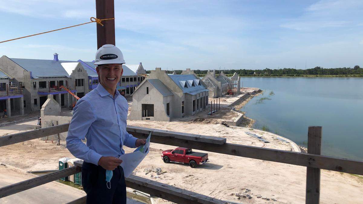 Tom Johnson stands on what will be a rooftop beer garden overlooking Kingfisher Lake in Lakewood Ranch’s new Waterside Place. The Lakewood Ranch new town center is scheduled to open in the first of second quarter of 2021.