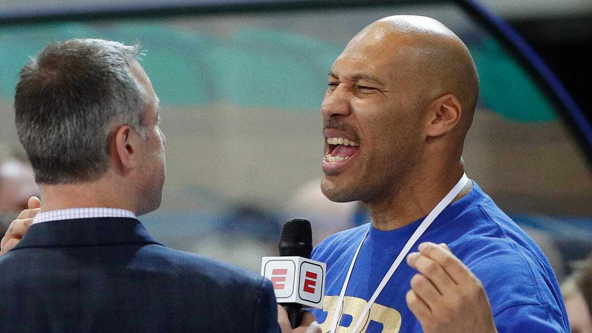 In this Jan. 9, 2018, file photo, LaVar Ball is interviewed after a basketball game in Prienai, Lithuania. LiAngelo and LaMelo Ball are leaving their Lithuania team by mutual agreement. BC Prienu Vytautas on Thursday, April 26, 2018, announced the departure of the younger brothers of Los Angeles Lakers rookie Lonzo Ball.