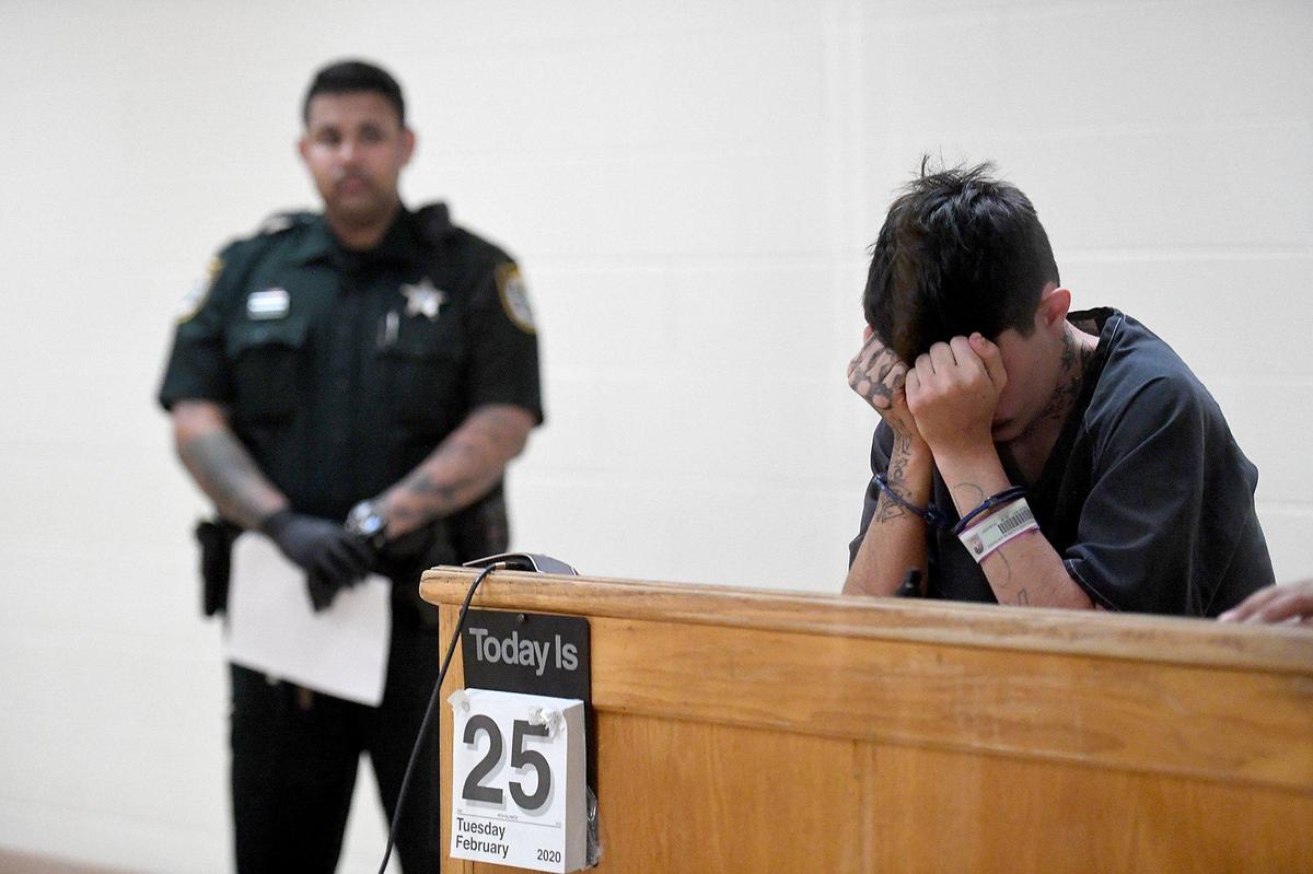 Kaleb Sutherland, 18, stands for his first court appearance at the Manatee County Jail. Sutherland has been charged with second-degree murder.