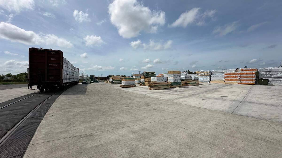All of the framing kits sitting on this concrete pad at 84 Lumber in Palmetto were expected to be delivered to building sites within 24 hours. The building materials are delivered to Palmetto by rail.