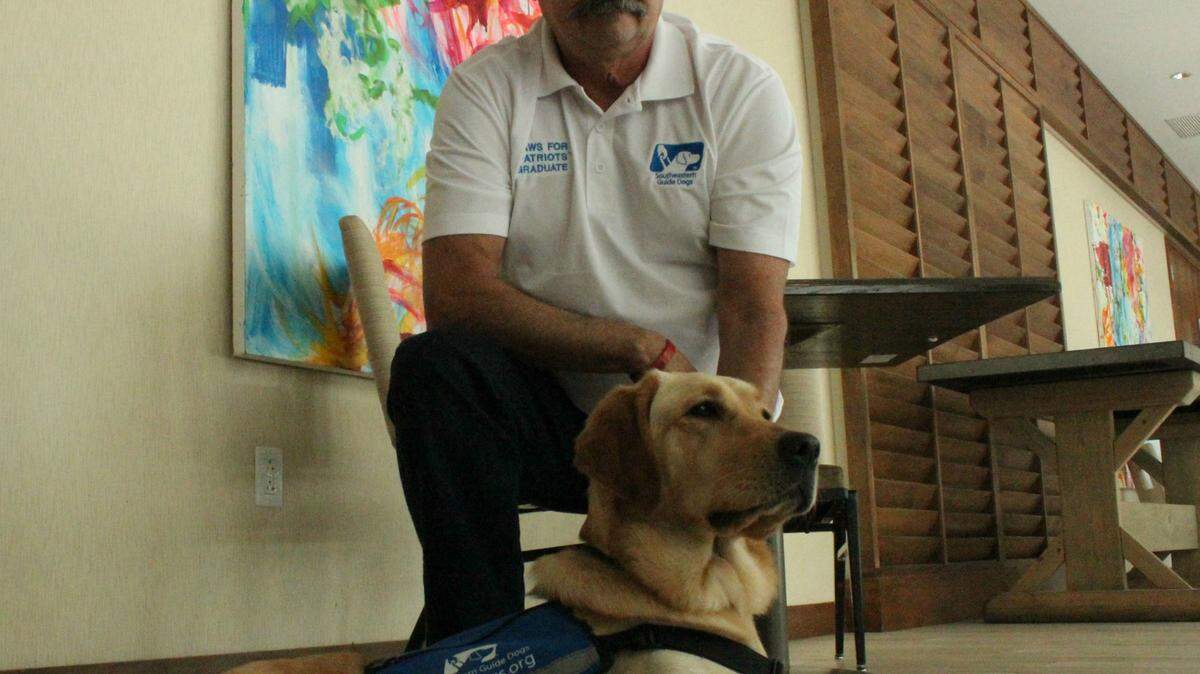 Vietnam War veteran James Willis graduated with his service dog Recon Wednesday during a luncheon in Sarasota. Recon was provided by Southeastern Guide Dogs. 
 JAMES A. JONES JR./Bradenton Herald