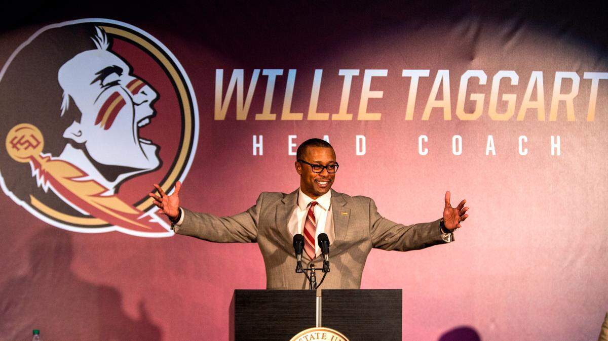 In this Dec. 6, 2017, file photo, Willie Taggart gestures as he is introduced as Florida State’s new football coach during an NCAA college football news conference in Tallahassee, Fla.