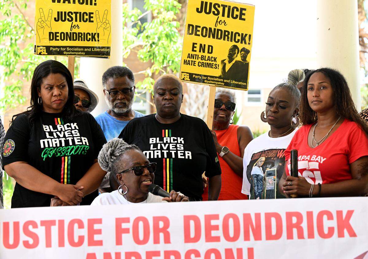 Angela Anderson, seated, speaks at a press conference held outside the Manatee County Judicial Center on Monday, June 9, 2025. Anderson’s family and supporters called on prosecutors to appeal the ruling which dismissed the case against the man who shot her son outside an Oneco bar.