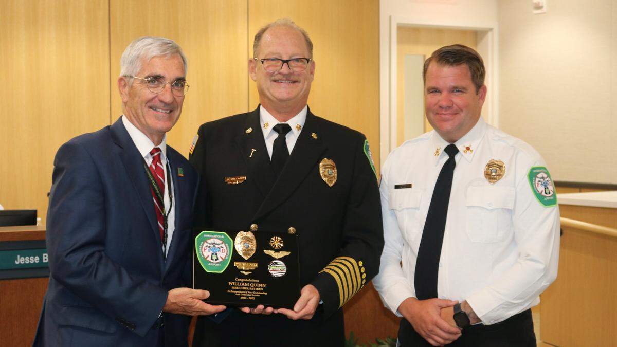 Sarasota Bradenton International Airport on May 23, 2022, said farewell to retiring airport fire chief Bill O’Neil (center). Also shown is airport president and CEO Rick Piccolo (left) and new fire chief Jason Hackley.