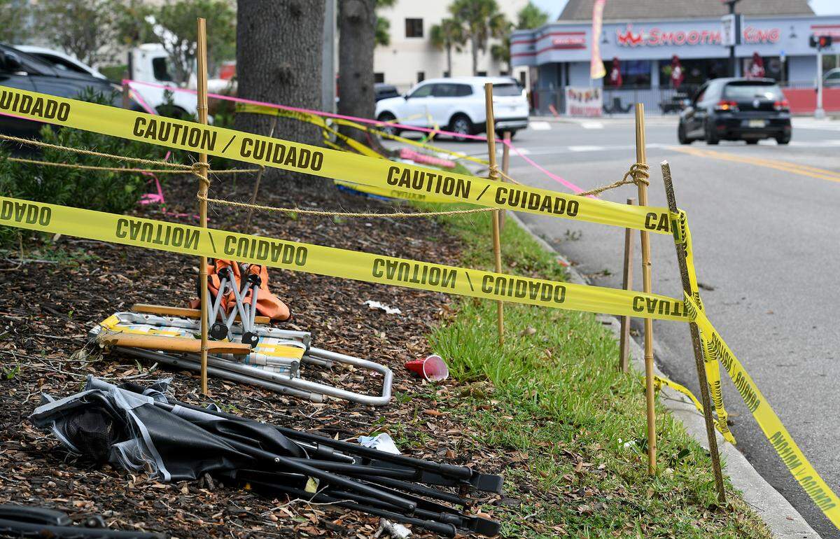 Tape and flags outline ‘reserved’ space in front of the Shake Pit on Manatee Avenue West in anticipation of Saturday night’s De Soto Parade.