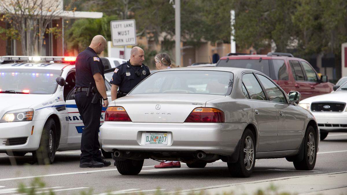 Bradenton police officers speak to a driver involved in a car versus pedestrian accident that occurred on Manatee Avenue in downtown Bradenton at about 10 a.m. Wednesday. MATT M. JOHNSON/Bradenton Herald