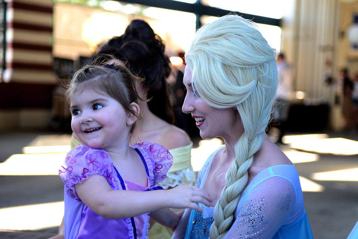Charlotte Runck, left hugs the Snow Queen Laurie Craddock during a past Pirates and Princesses Night at Bradenton's LECOM Park. The event is back Saturday, April 7, 2018 to kick off the Bradenton Marauders' home schedule for the 2018 baseball season.