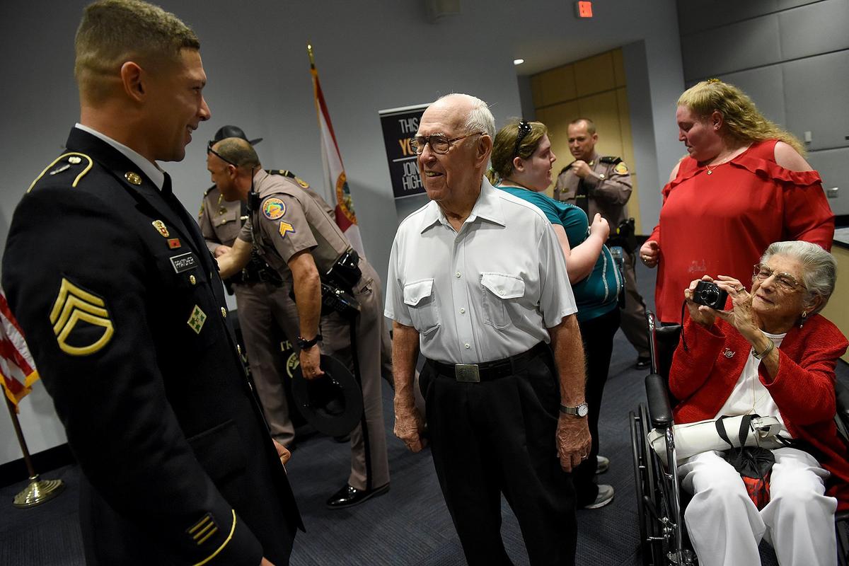 SSGT Gregory Buono greets Dale Young and his wife, Marilyn, before he was presented the Governors Veterans Service Award. Young, a decorated World War II Veteran, served in the US Army from August 1944 to November 1946. Young is the father of Trooper Jeff Young, who was killed in the line of duty while attempting to arrest a drug courier during a traffic stop in Manatee County on August 18, 1987.