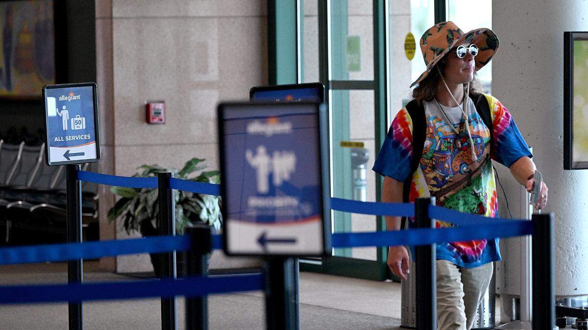 A traveler walks through the terminal at the Sarasota Bradenton International Airport, Sept. 25, 2023.