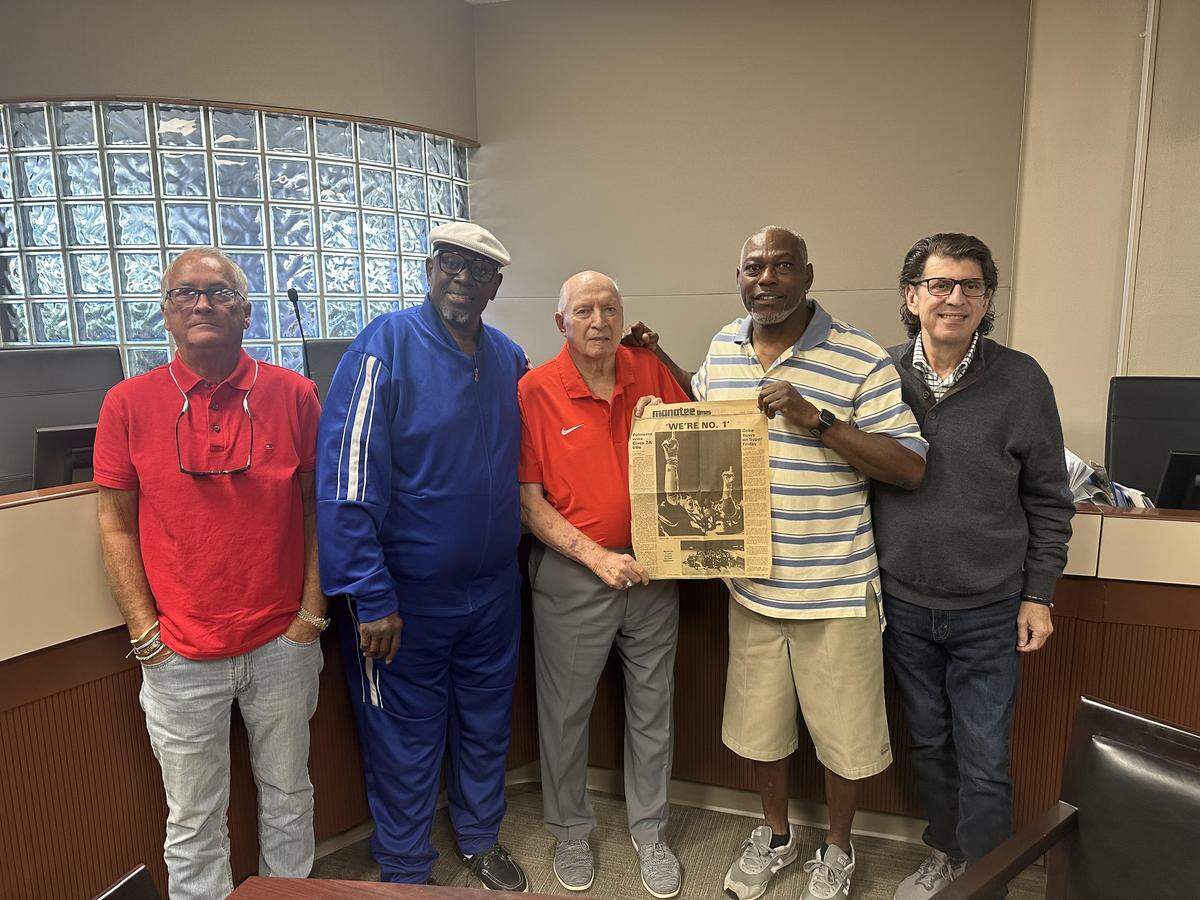 The 1975 Palmetto Tigers reunited 50 years after winning Manatee County’s first state football championship. From left to right: quarterback Ronnie Deans, wide receiver Wilmore Fowler, head coach Frank Turner, running back Jackie Garvin and offensive lineman Tom Tryon.