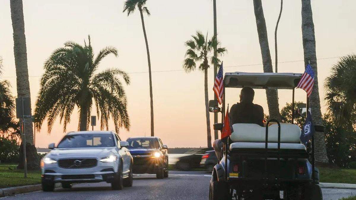 Dave Smewing, 56, of Dunedin, watches the sunset while parked along a city street Tuesday, Dec. 6, 2022 in Dunedin.