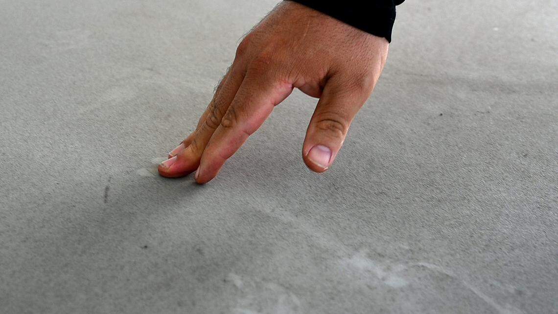 Dirt blowing from the nearby Rye Ranch construction site in Parrish coats Foxbrook resident Marcos Alvarez’s outdoor furniture. Photos taken March 4, 2025.