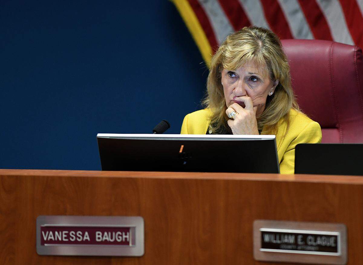 02/23/21-- After a months-long investigation, the Manatee County Sheriff’s Office concluded that Commissioner Vanessa Baugh’s COVID-19 vaccine VIP list did not break the law and she will not face any criminal charges. In this Bradenton Herald file photo, Commissioner Vanessa Baugh listens during a public meeting on Feb. 23, 2021. during a meeting of the Manatee County Commission where they approved a separation agreement that Cheri Coryea negotiated with her legal team and the County Attorney’s Office.