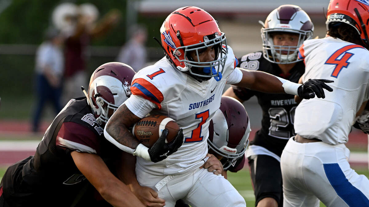 Southeast High’s Ostave Dorvilus runs the ball against Riverview High in Sarasota on August 25, 2023.