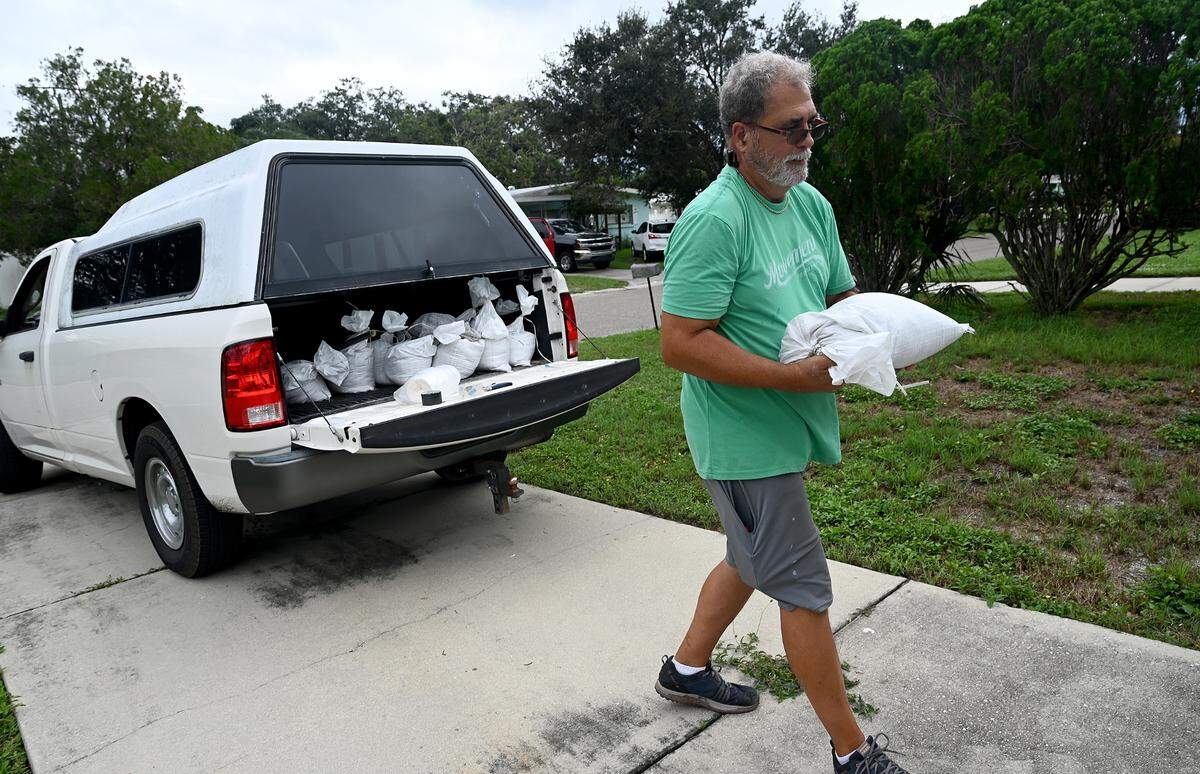 George Bourne readies his home in Bradenton for the second hurricane in the span of a month as Hurricane Milton approaches Manatee County on Oct. 7, 2024.