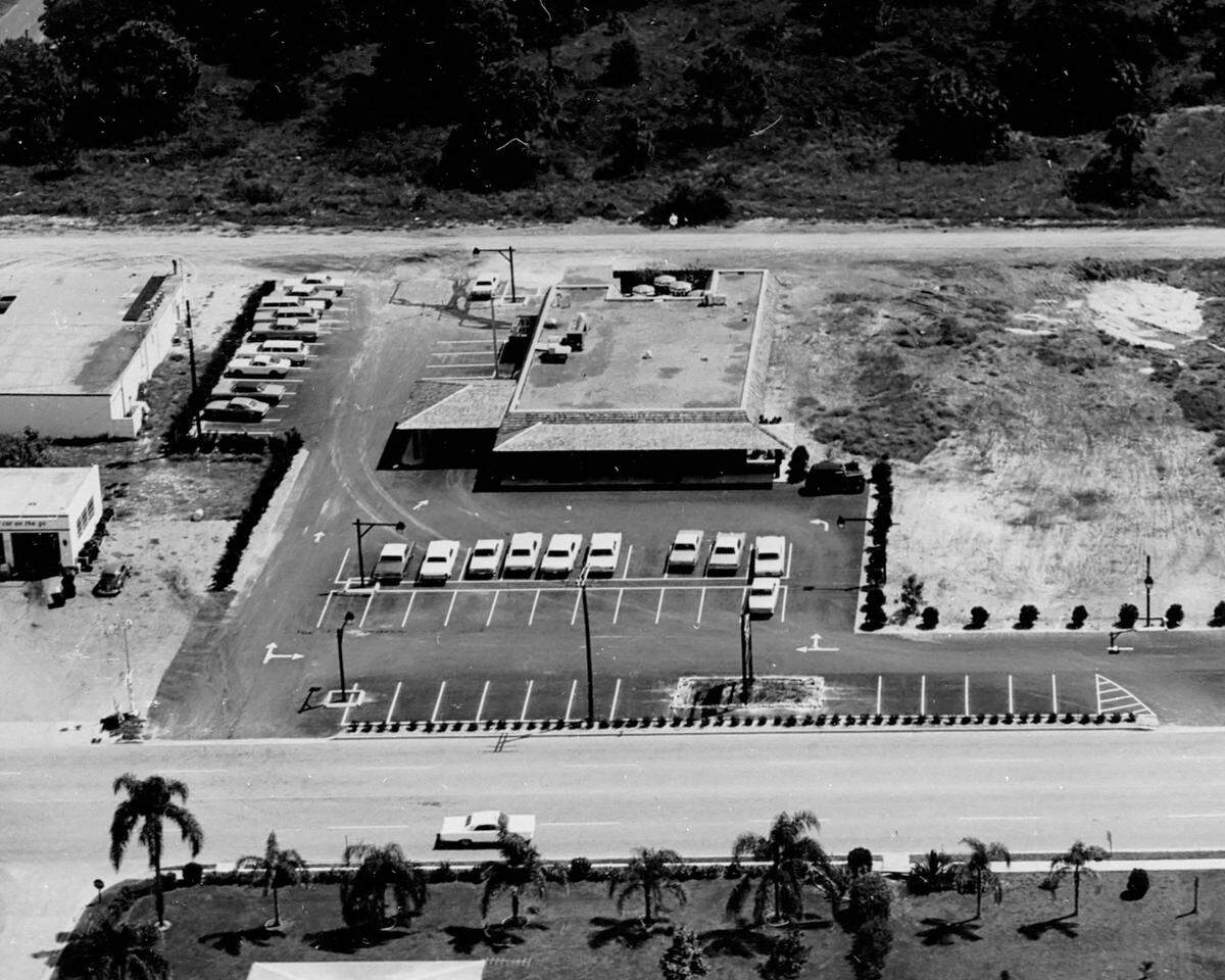 Looking east over a restaurant and movie development at 2615 26th Street West in Bradenton. This was the eventual home of a small movie theater and a restaurant owned by Chris McGuire (of the 1950s-1960s pop group the McGuire Sisters ). It was called McGuire’s Pub and was the first of a chain of restaurants (later small movie theaters were added) with locations on the east coast of Florida. The Bradenton location opened August 30, 1968.