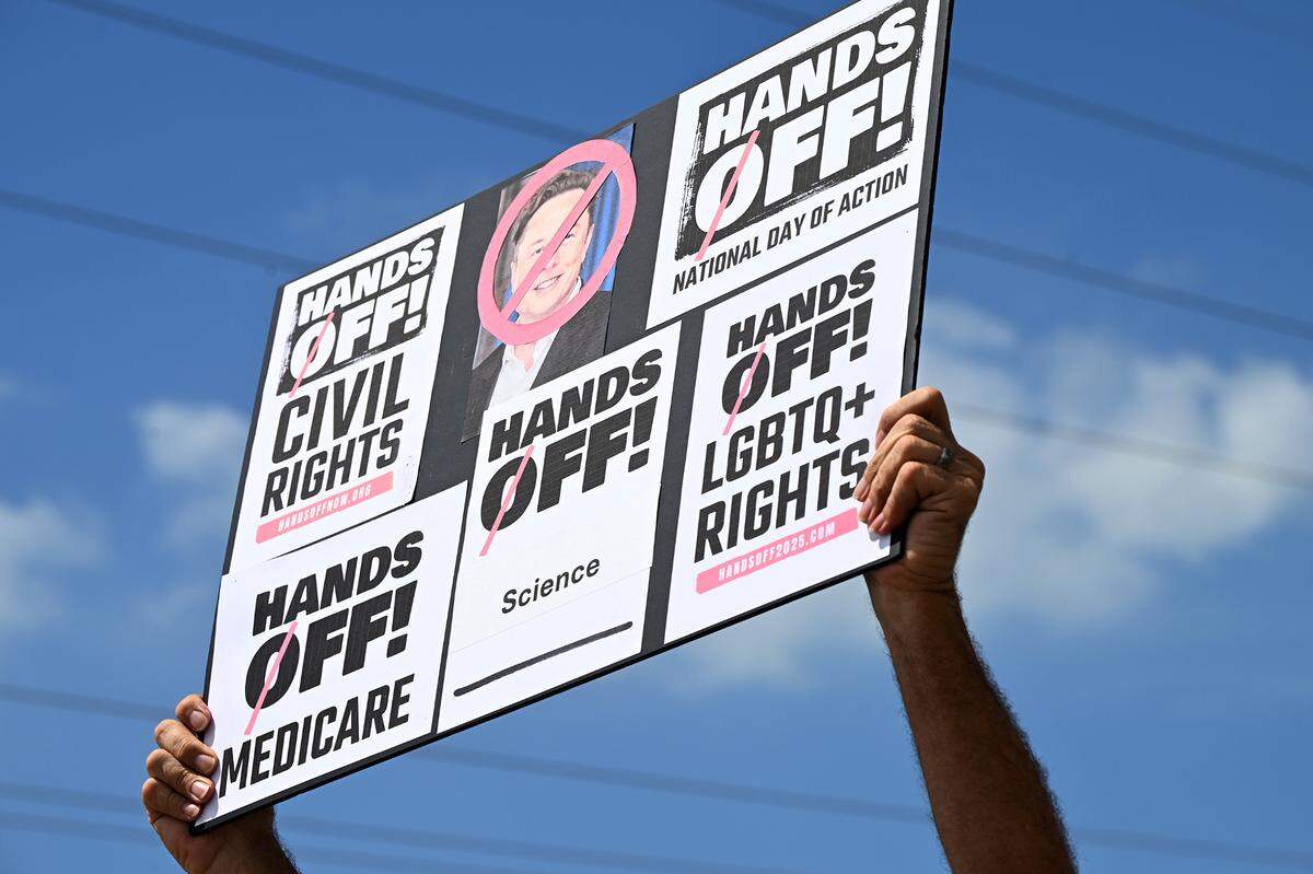 Hundreds of protestors gathered Saturday, April 5, 2025, on Cortez Road West in one of the many national “Hands off” protests against President Donald Trump’s policies.