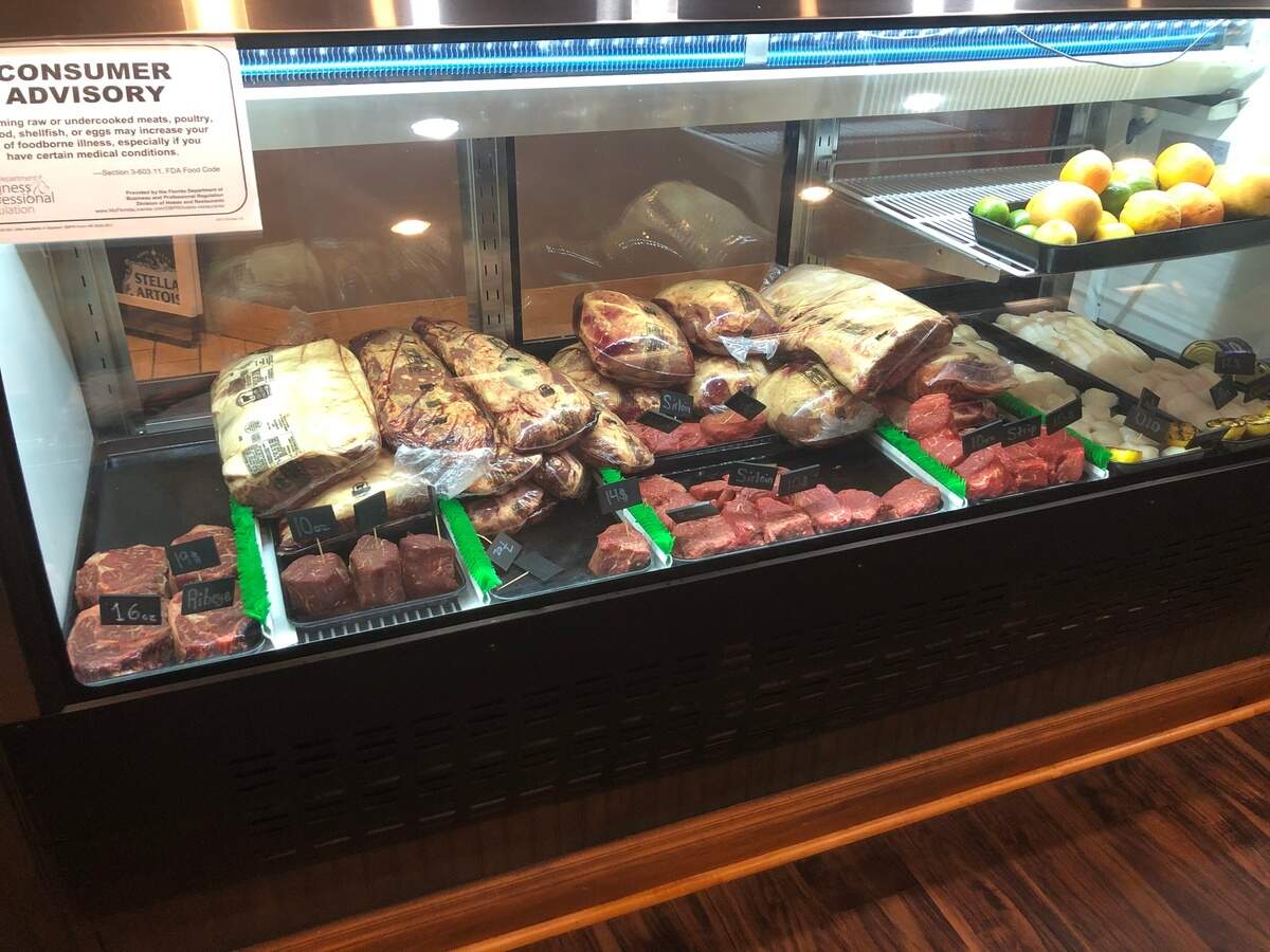 Bourbon & Bones has a market in its front foyer, where customers can buy cuts of meat to cook at home.