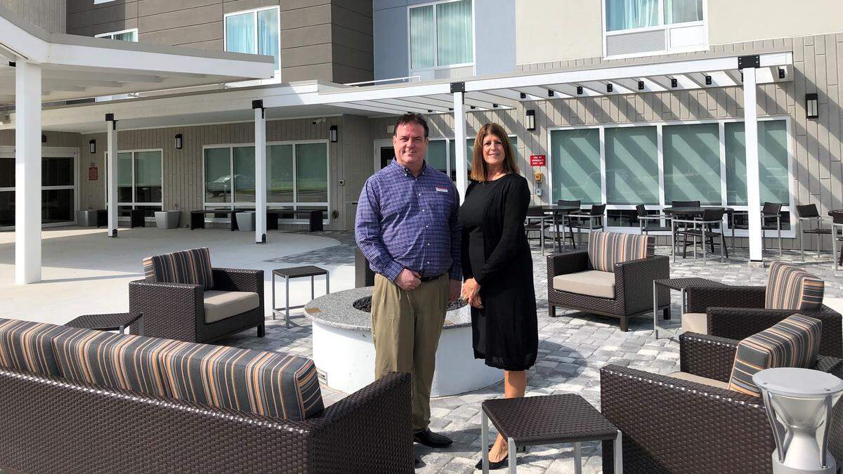TownePlace Suites by Marriott, an extended stay hotel, opened recently at 5401 Cortez Road W., Bradenton. General manager Jeff Morgan and sales manager Cynthia Fenton are shown at the firepit and grill area in front of the hotel.