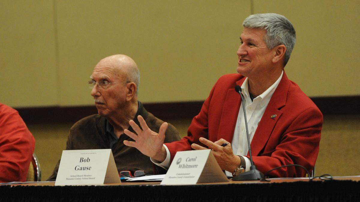 Bob Gause, Manatee County school board, addresses a question to Jessica Spencer, with the Manatee County Substance Abuse Prevention Coalition, at the Council of Governments meeting Tuesday at the Bradenton Area Convention Center in Palmetto. 
 GRANT JEFFERIES/Bradenton Herald