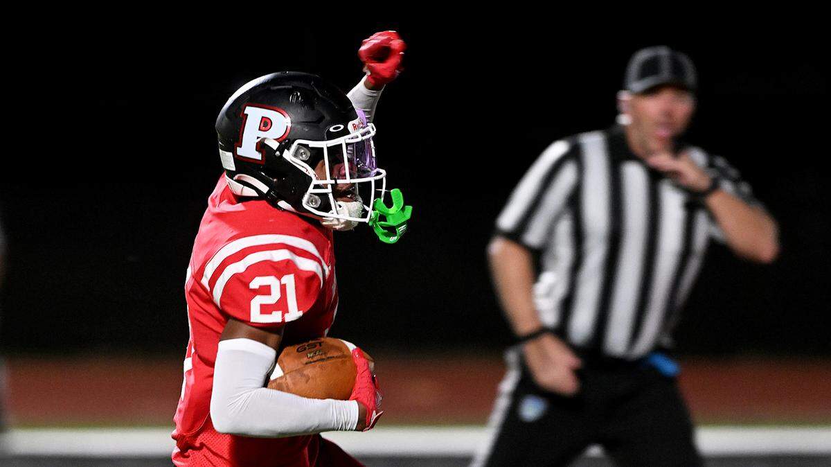 Palmetto’s #21 celebrates a touchdown as he approaches the end zone against Manatee on Friday, Oct. 27, 2023 in Palmetto.