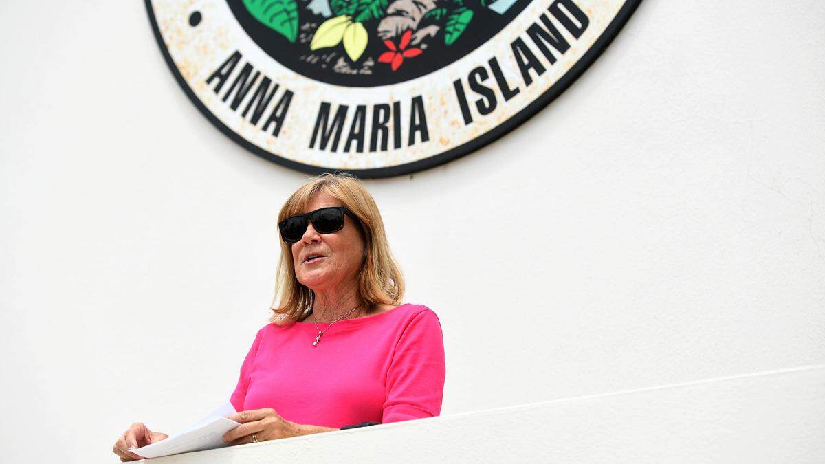 Manatee County Commissioner Carol Whitmore makes a statement outside the Holmes Beach Police station where she says she turned in campaign signs from a challenger that she believed were illegally placed.