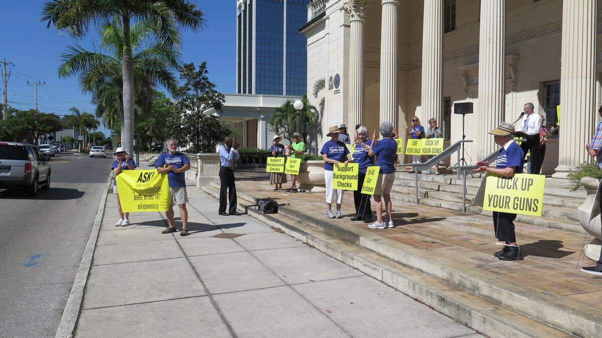 Members of the Sarasota County Chapter of the Brady Campaign to Prevent Gun Violence attend a rally held Thursday evening in Sarasota.AMARIS CASTILLO/Bradenton Herald
