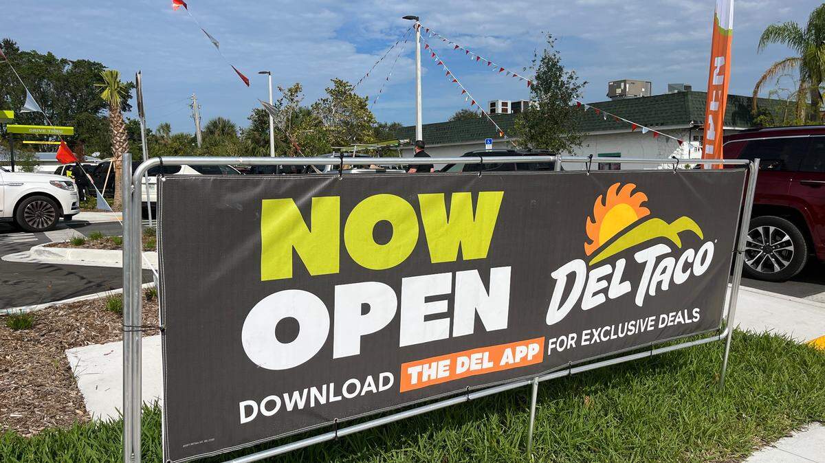 On the lawn of Bradenton’s first Del Taco fast food restaurant on Manatee Ave., now open sign.