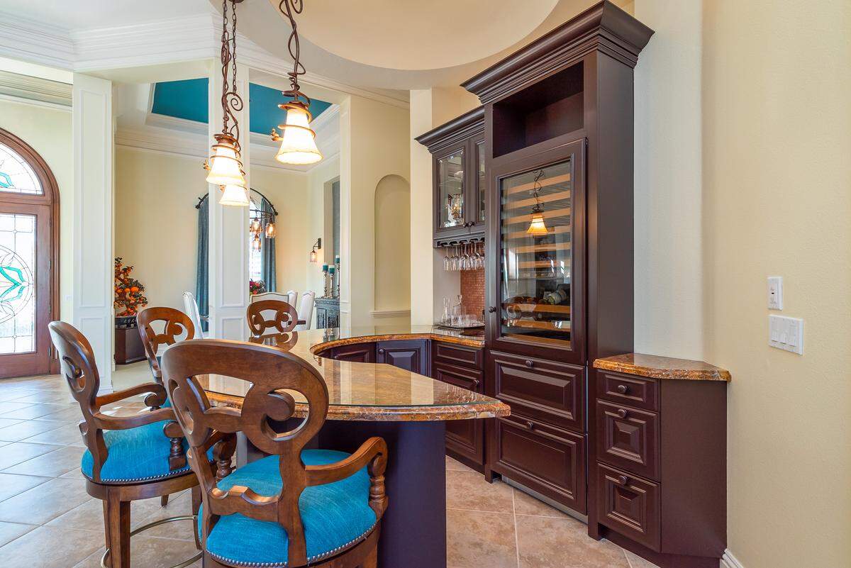 The home includes a bar with a wine fridge and two beverage cooler drawers.