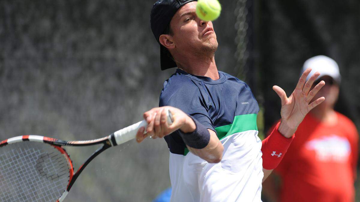 Jose Hernandez-Fernandez of the Dominican Republic plays in a match with Jose Statham of New Zealand on Monday during the 2016 Joey Gratton Sarasota Open at Lakewood Ranch Athletic and Tennis Center. 
 GRANT JEFFERIES/Bradenton Herald
