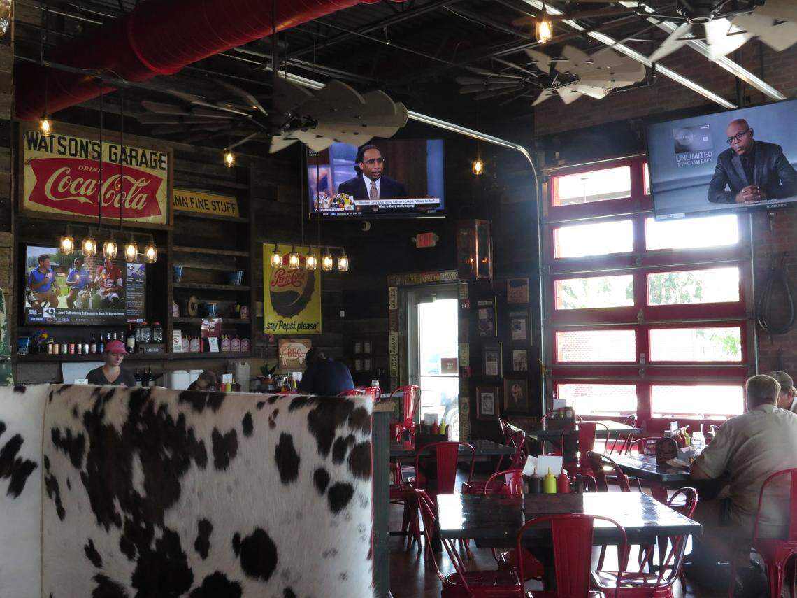 Other decor touches at BoneYard BBQ include vintage license plates, old-time signs and cowhide decorated booths.