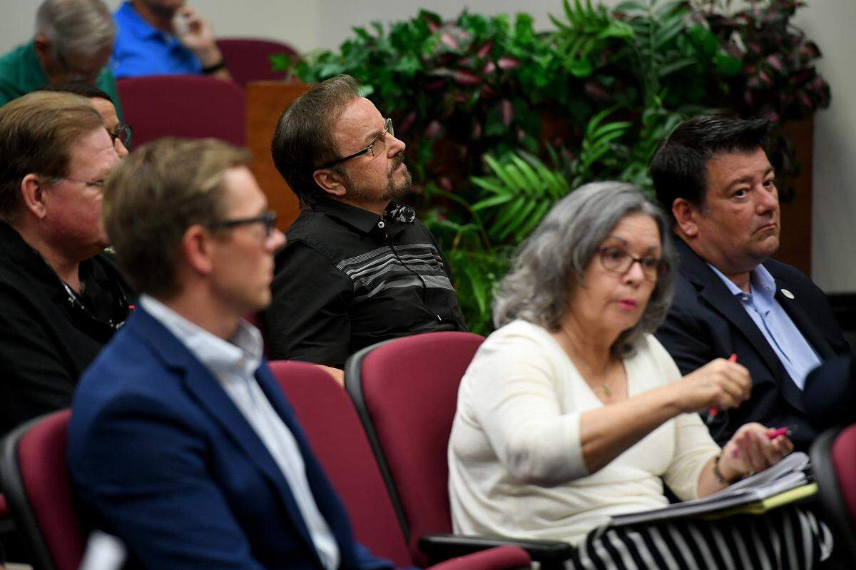 Pastor Phil Derstine, center, during a planning meeting to consider allowing Cirque Italia to set up in Oneco.