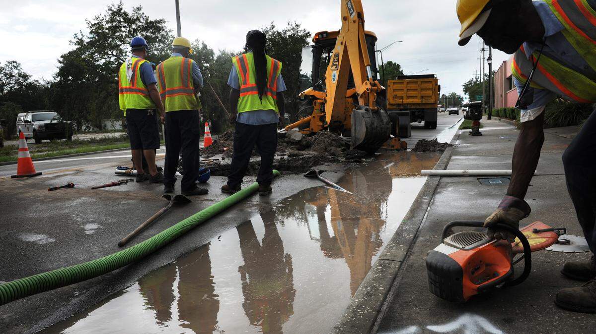 Workers repair a water main break in the 900 block of 14th Street West in July 2015. For the past several years the city has been aggressively investing in replacing decades old infrastructure and this year’s record $142 million budget, passed Wednesday, will continue those efforts.
