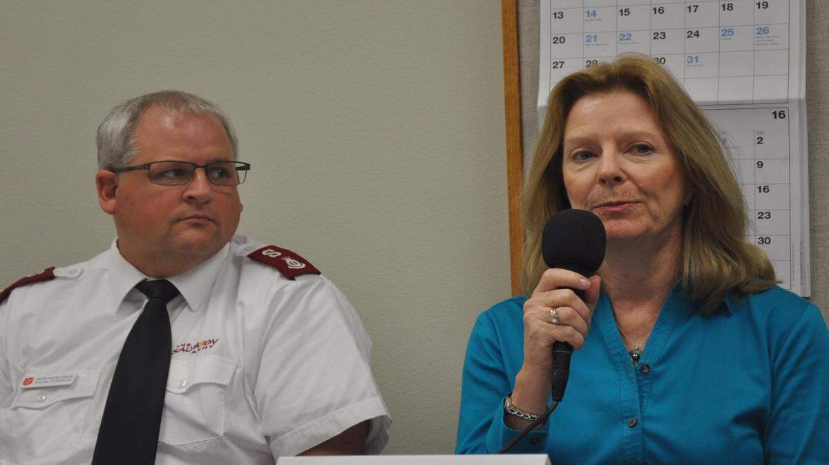 Salvation Army Maj. Dwayne Durham of the Salvation Army listens as Adell Erozer, executive director of Turning Points, makes a point during a roundtable discussion on homelessness Friday at the Bradenton Herald. 
 MARC R. MASFERRER/Bradenton Herald