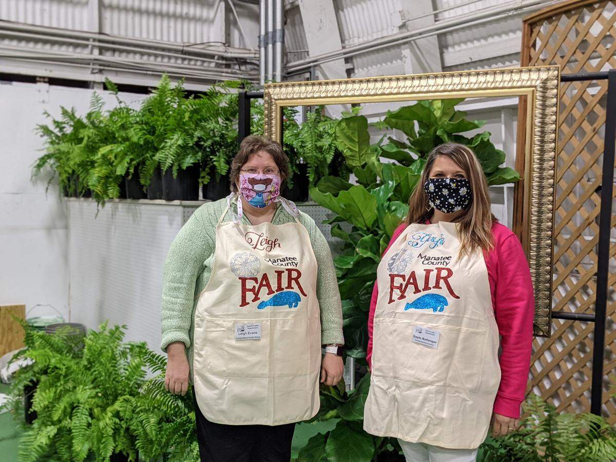 Leigh Evans, left, and Gayle Ballenger, right, are Palmetto Charter School teachers and members of this years Arts and Crafts committee for the Manatee County Fair. On opening night, they welcomed guests and ran the mercantile counter selling t-shirts, hats and cookbooks.