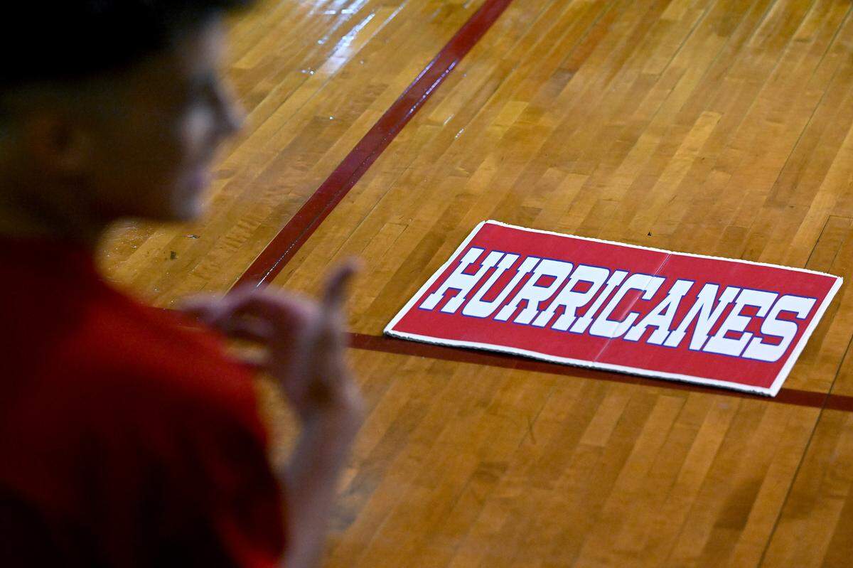 The Manatee Hurricanes High School football team practice indoors in the JROTC gym on the campus as the heat index pushed 94 outside.