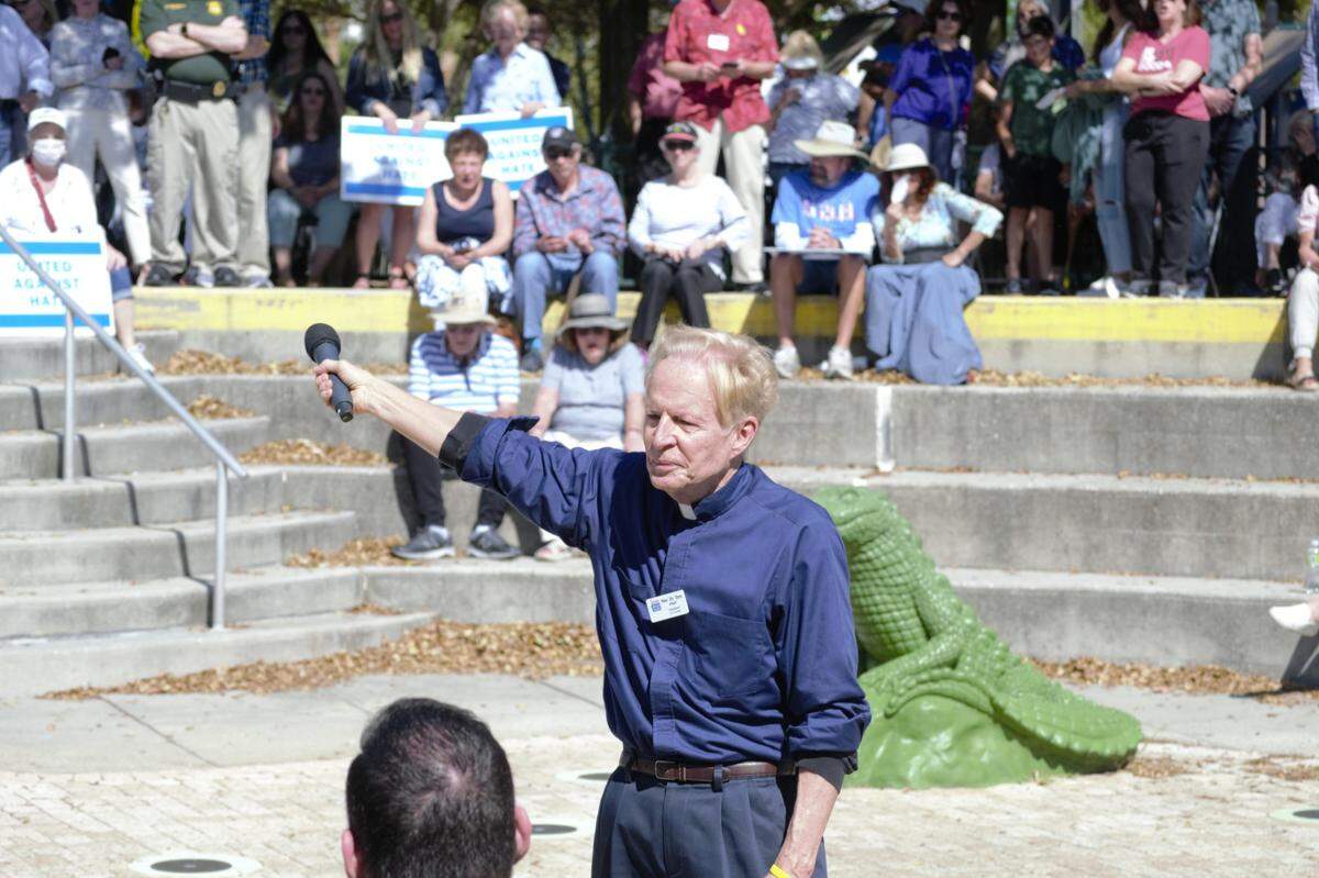 Sarasota Ministerial Association president Tom Pfaff Rabbi Michael Shefrin leads the crowd in a call and response at a “United Against Hate” gathering at Bayfront Park in downtown Sarasota on Feb. 20, 2022.