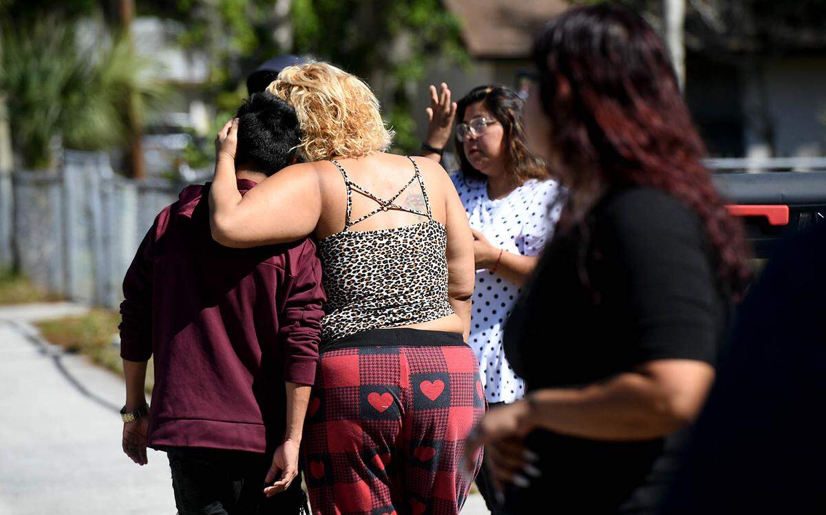 02/12/21--Friends and family of Antonio Aguirre, 20, mourn his loss where he was fatally shot in a drive-by shooting in the 700 block of 25th Street East Thursday night.