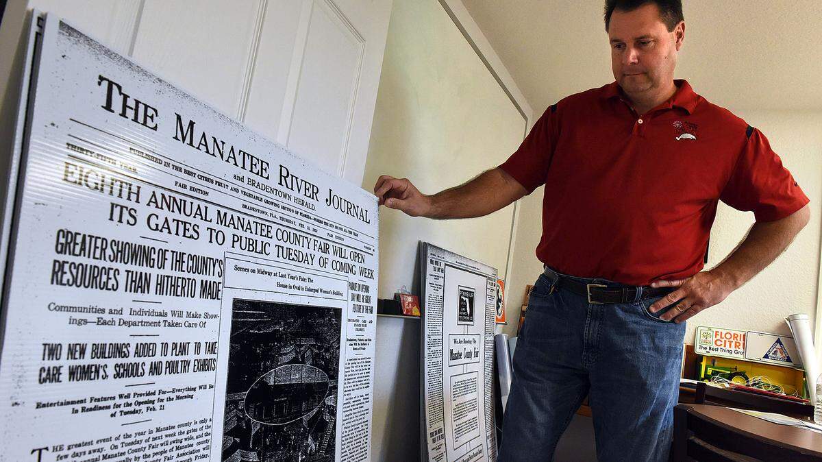 Manatee County Fair manager Dan West shows blow ups of old newspapers from the early 1900s about the fair.TIFFANY TOMPKINS-CONDIE/Bradenton Herald