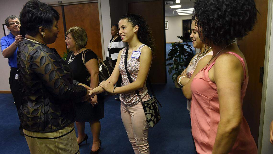 Superintendent Diana Greene greets student artist Joselieann Rodriguez, 15, at a reception for students and families to view art at the School District Wednesday night. The school board will be changing the artwork every two months. 
 TIFFANY TOMPKINS-CONDIE/Bradenton Herald
