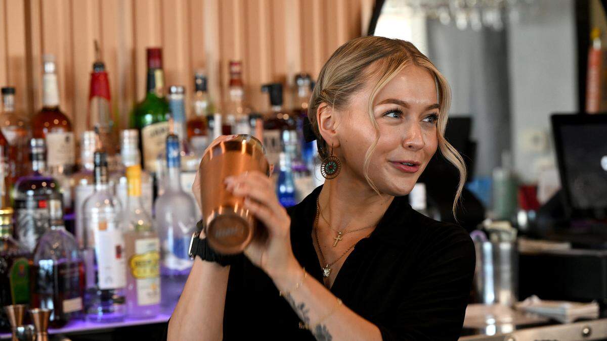 Manager Sasha Davis mixes up a blackberry coconut mojito at Pork Belly’s, 9516 Cortez Road West.