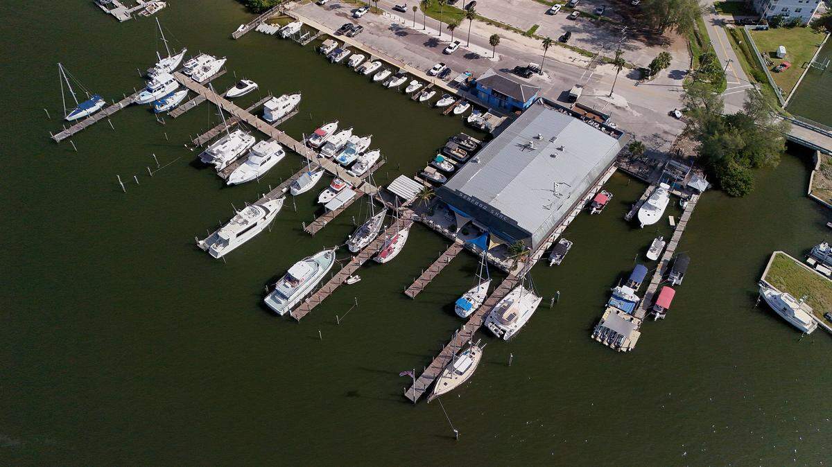 Seafood Shack owners have sent eviction notices to local business owners before Manatee County can close the purchase of the iconic Cortez restaurant and marina.