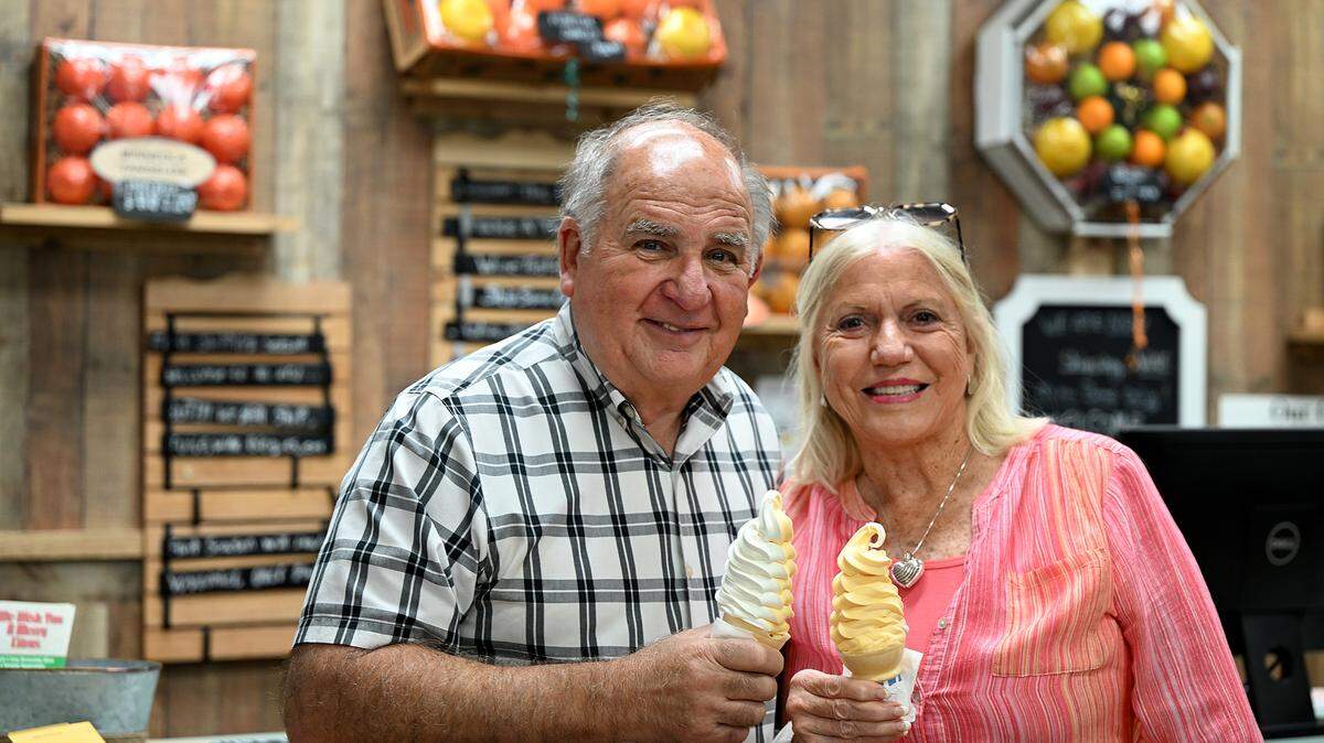 Dean and Janet Mixon hold ice cream cones at Mixon Fruit Farms on May 25, 2023.