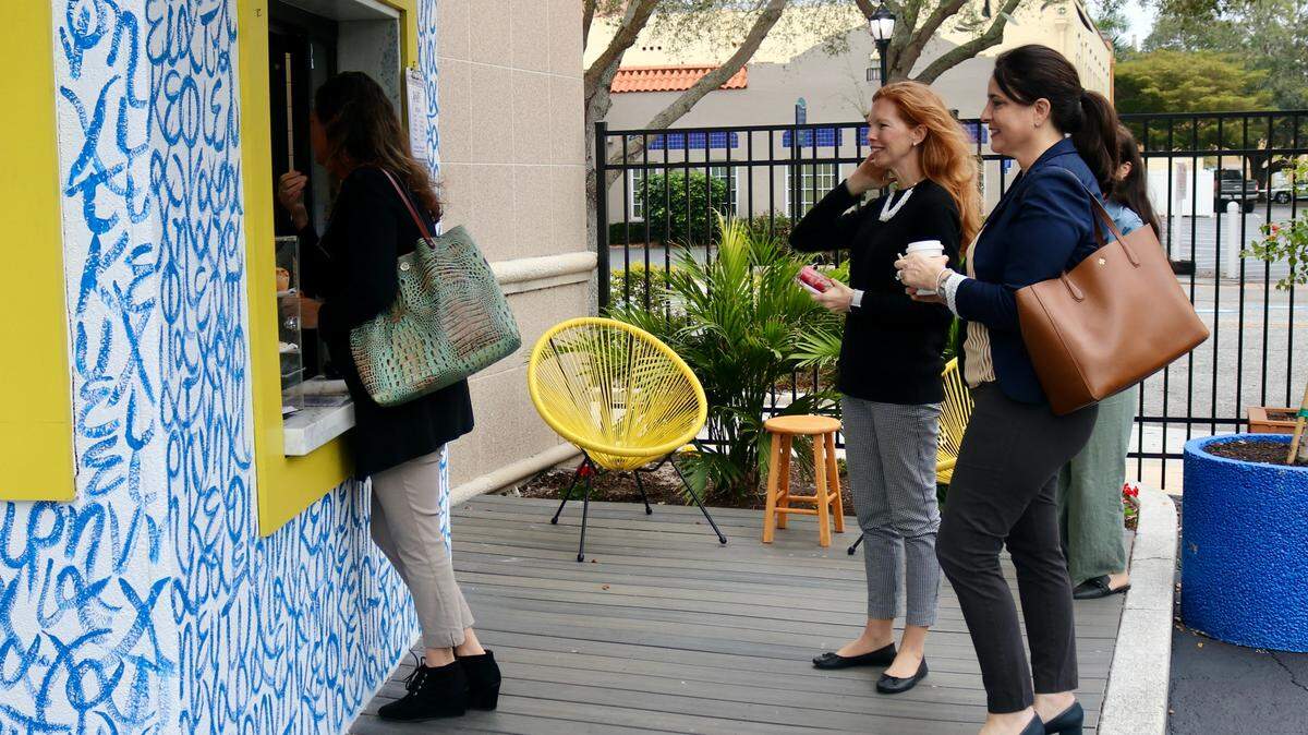 Customers line up to place their orders at the walk-up windown of Kefi Streetside Cafe, 1201 6th Ave. W., Bradenton on 2/8/2021.