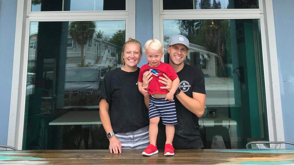 Andrew and Ammanda ​ Simonetti opened Pizza Social last June at 308 Pine Ave., Anna Maria. They are shown above with their son, Jordan.