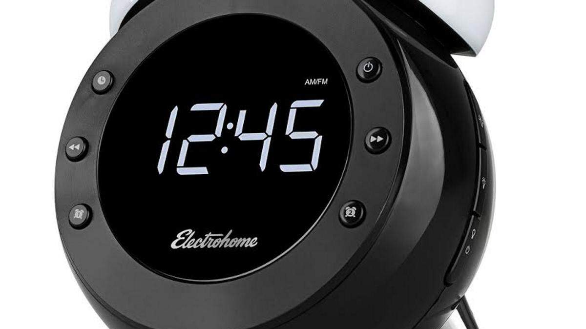 Electrohome: Retro Alarm Clock Circular, vintage design alarm clock dresses any room or nightstand and useful features upgrades user wake up experience· Twin LED lights brighten as a userís wakeup time approaches, ideal for those sensitive to loud sounds or who have trouble waking up· Wave hand over the Retro Alarm Clock to activate the motion sensor which turns on its integrated lightbulbs and can also be used to activate the snooze button· Stores up to 20 AM/FM stations to quickly tune into favorite stations· Useful features include four display dimming options, calendar and indoor temperature display, an easily programmable dual alarm with weekend cancelation, the option to wake to buzzer or radio, and convenient sleep and nap timers· Integrated SelfSet technology allows users to set up Daylight Savings Time, which conveniently adjusts each spring and fall· Built-in backup battery ensures the alarm will function even through a power outage· WakeUp technology keeps alarm settings active, ensuring users will sleep soundly without missing a beatAvailable at: Electrohome.com Price: $34.99Website: www.electrohome.com