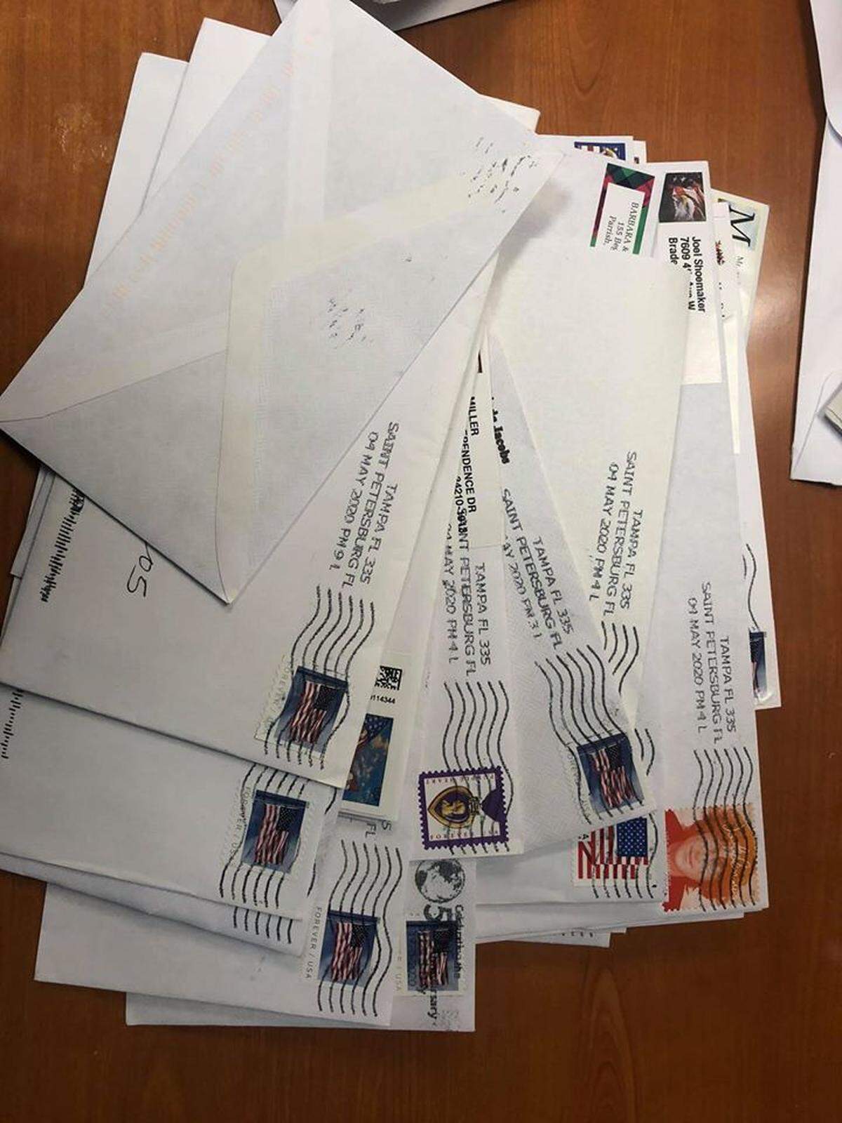 A stack of envelopes from readers with checks for the Bradenton Herald Coronavirus Reporting Fund.